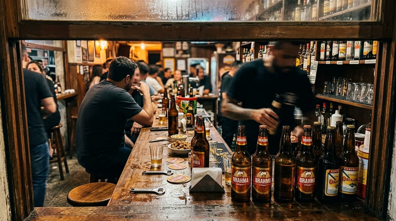 Bar counter in a boteco with Brahma beer bottles and warm light